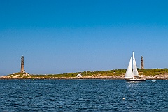 Sailboat Passes Cape Ann (Thacher Island) Twin Lights